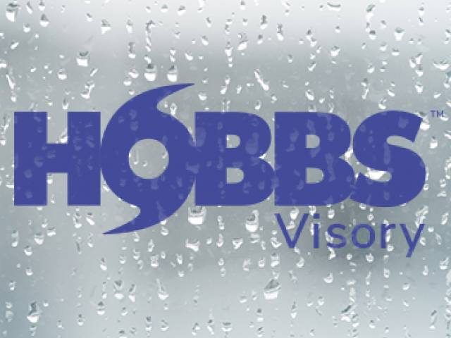 Sun peaking through the clouds at sunset on Holden Beach